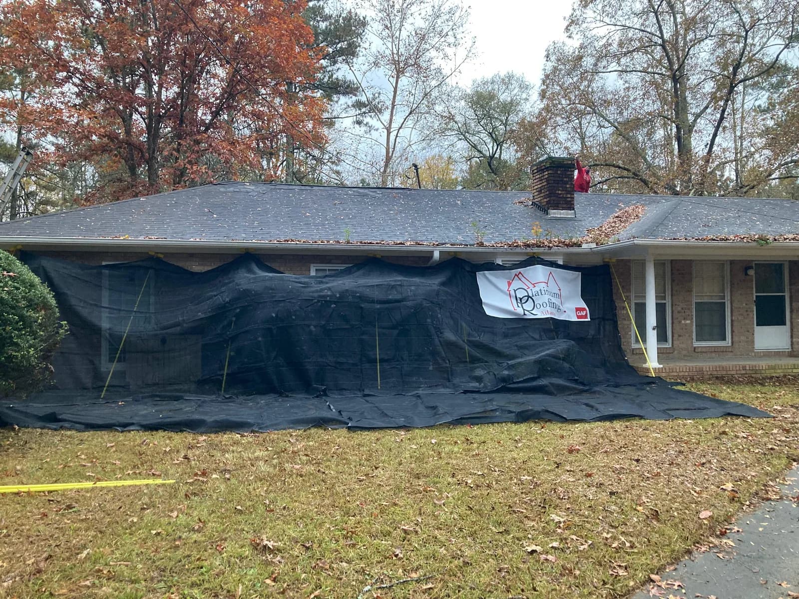 Roof replacement job site protected with tarps in North Georgia