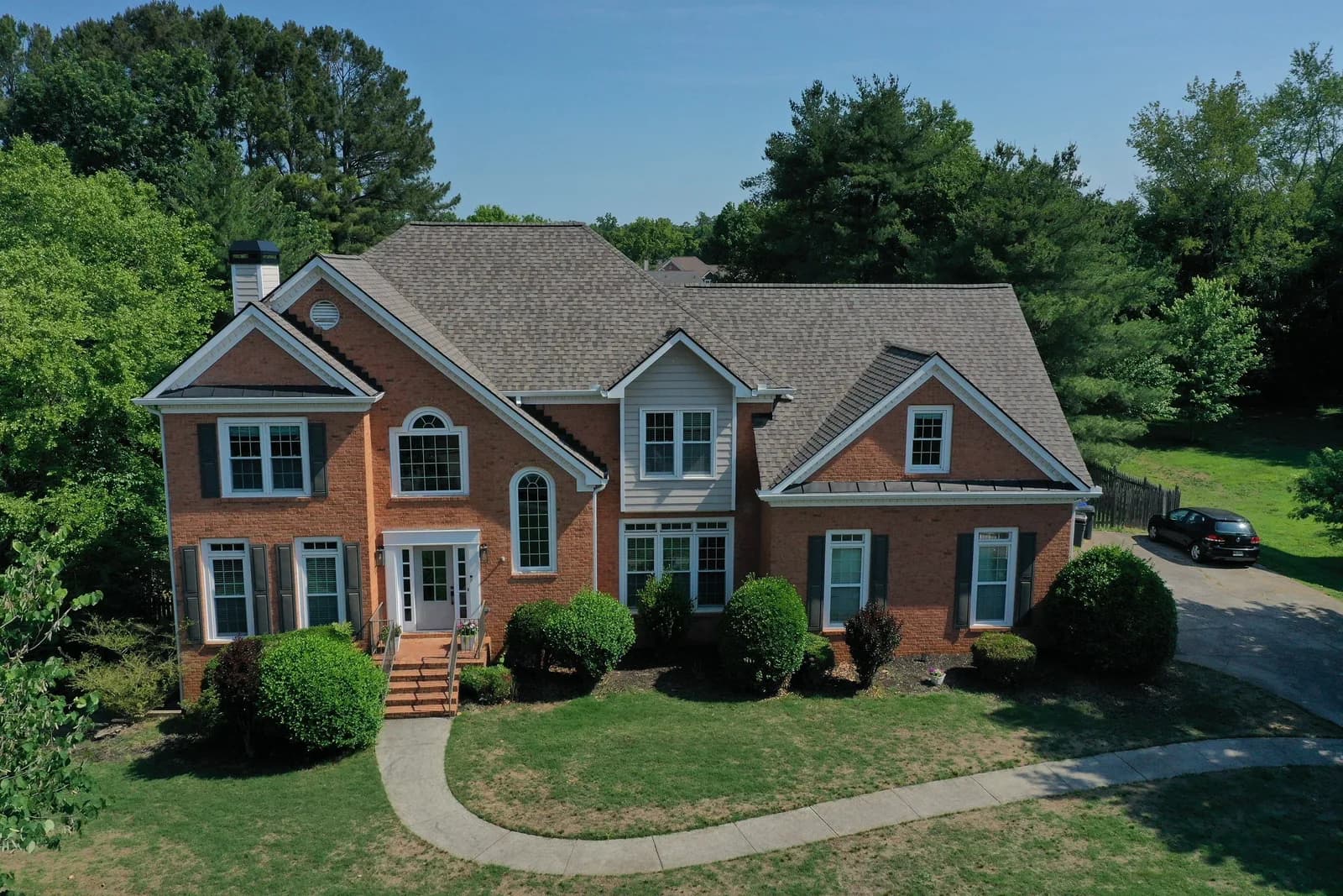 Before and after of a North Georgia roof replacement by Platinum Roofing
